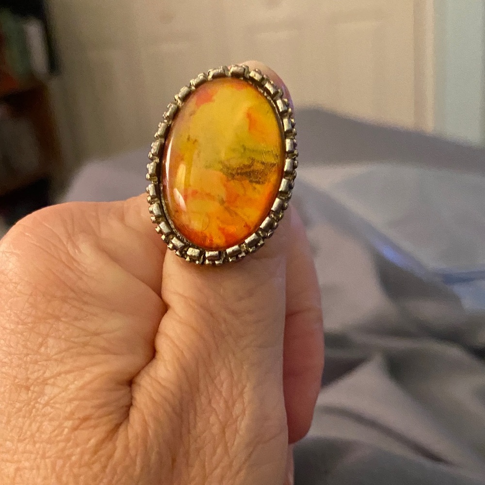 Vibrant Gold and Orange BalticAmber Oval Ring in Silver Setting.